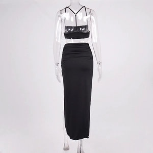 Detail of ruched waistline and back view of a black two-piece summer crop top and maxi skirt