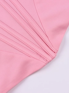 Detail view of pink corset crop top featuring reinforced stitching and ribbed fabric texture