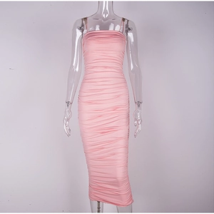 Close-up of ruched detail and pink elastic fabric on a slim fit midi sundress