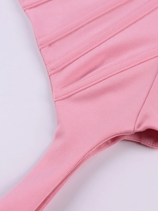 Close-up of pink boned corset top with vertical stitching and thin shoulder straps