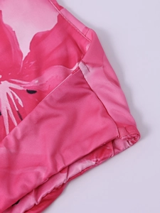 Close-up of pink floral print fabric with high-quality flat seam stitching details
