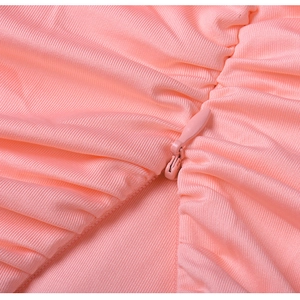 Detail of pink ribbed fabric showing high-quality invisible zipper and fine stitching
