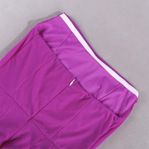 Detail of purple dress showing invisible zipper and non-slip waistband on smooth fabric