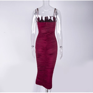 Detail view of the wine red ruched midi dress showing back zipper and textured fabric