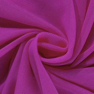 Close-up of breathable magenta mesh fabric texture with elegant spiral pleated details