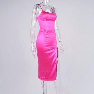 Detail of hot pink satin midi dress featuring a high side slit and slim fit silhouette