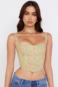 Detailed view of floral corset top featuring square neckline and fishbone hemline detail