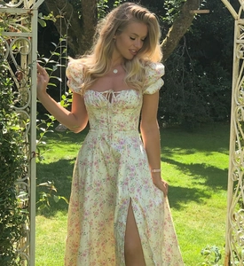 Detail showing vintage puff sleeves and tie neckline on this light yellow floral dress