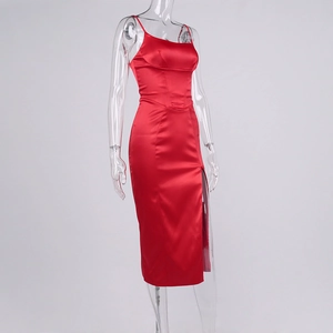 Detailed side view of a red satin midi dress with fishbone corset waist and high slit
