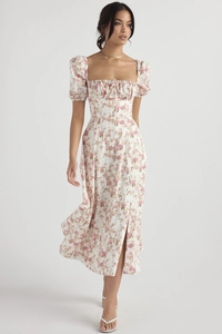 Close-up of square neck floral dress featuring drawstring bust and puff sleeves details