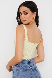Floral bustier top back view showing invisible zipper detail and slim fit design