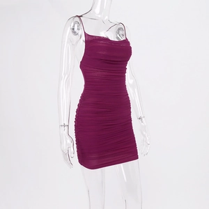 Close-up of ruched texture and magenta bodycon fabric on this sexy backless dress