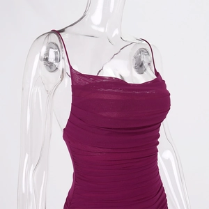 Close-up of plum purple ruched mesh fabric on a sexy backless bodycon dress for women