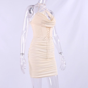 Detail view of ruched bodycon dress with criss-cross lace-up waist and halter neckline