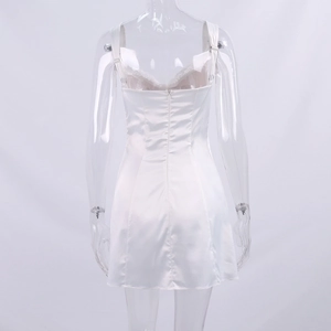 Detailed back view of white satin mini dress featuring lace trim and invisible zipper