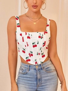 Detail of floral corset top with cherry print, square neck and irregular hemline