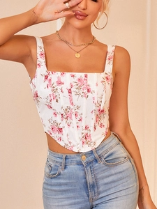 Detailed close-up of floral corset top with pink roses and structured boning seams