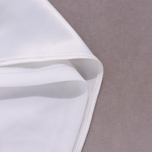 Detailed close-up of white satin dress hem featuring precise double-needle stitching
