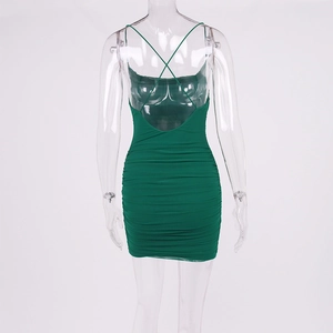 Detail of backless cross-strap design and ruched texture on dark green bodycon dress