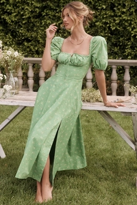 Detail of square neckline with drawstring and slit on light green floral midi dress