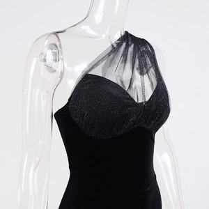 Detail of sexy one-shoulder dress with transparent mesh and sparkling silver sequins