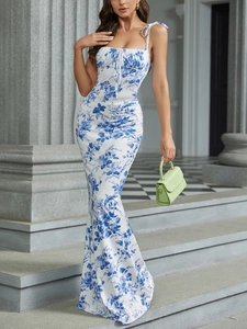 Detailed view of floral backless maxi dress with tiered ruffles and spaghetti straps