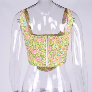 Detailed view of floral corset top with built-in boning and silver front zipper closure