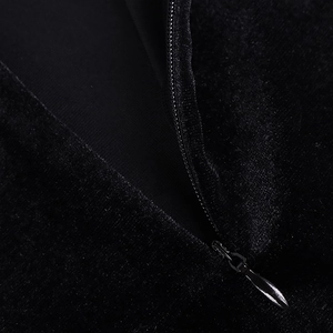 Close-up of invisible zipper and premium black velvet fabric on the bodycon dress