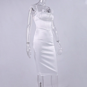 Detail of white satin dress featuring square neck pleats and delicate lace shoulder straps