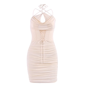 Creamy white bodycon mini dress with halter cross neck and ruched mesh details