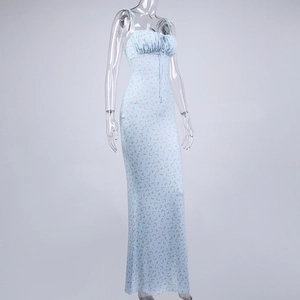 Detail of light blue floral dress showing ruffled bust and lace-up bow tie detail