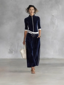 Tuta da donna in velluto blu scuro con collo alto a zip e pantaloni a gamba larga