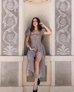 Detail shot of vintage floral dress showing high slit design and light fabric texture