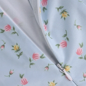 Detail of floral chiffon fabric featuring a hidden zipper and high-quality stitching