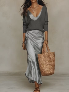 Women fashion two-piece set with dark grey V-neck knit top and silver satin maxi skirt