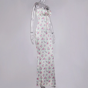 Detail of floral printed maxi dress with ruffled neckline and delicate tie-up straps
