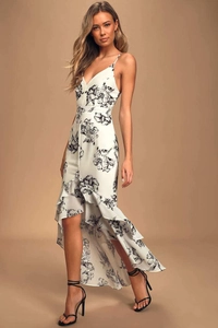 Detail of high-low floral maxi dress with deep V-neck and ruffled asymmetrical hemline