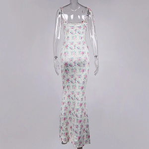 Detail of floral spaghetti strap maxi dress featuring a back zipper and adjustable ties