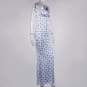 Detail of floral backless long dress featuring blue print and pleated bust design