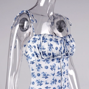 Detail of ruched bust and blue floral porcelain print on the backless summer dress