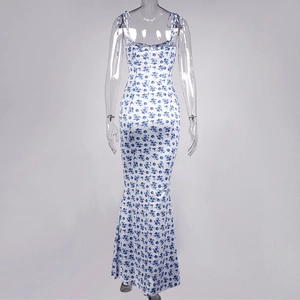 Detail of floral backless long dress featuring thin straps and blue porcelain print