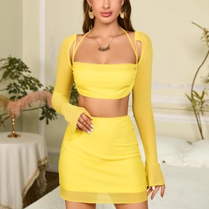 Sexy bright yellow two-piece mesh set with halter neck long sleeve top and mini skirt