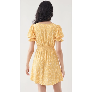Back view of summer yellow floral mini dress with puff sleeves and elastic high waist