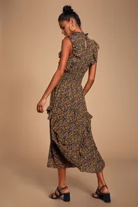 Détail d'une robe bohème fleurie montrant le smock et les volants sans manches