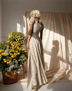 Floral print maxi dress detail with square neckline and puff sleeves in vintage style