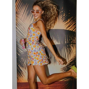 Women's V-neck floral mini dress with sleeveless straps and tie-waist in a slim summer fit