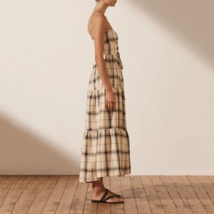 Beige plaid tiered midi dress with spaghetti straps and side waist cut-out details