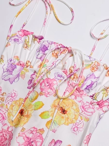 Detail of floral backless mermaid dress with drawstring bow and thin straps