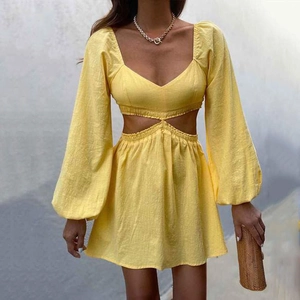 Chic ginger yellow A-line dress with lantern sleeves and sexy waist cut-out detail