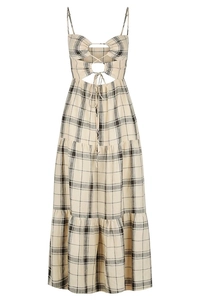 Close-up of the beige plaid pattern and lace-up cutout detail on the summer dress